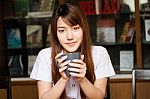 Portrait Of Thai Adult Student University Uniform Beautiful Drinking Coffee Stock Photo