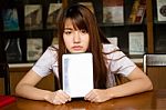 Portrait Of Thai Adult Student University Uniform Beautiful Girl Using Her Tablet Stock Photo