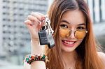 Portrait Of Thai Chinese Adult Beautiful Girl Denim Blue Bag And Key Stock Photo