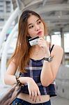 Portrait Of Thai Chinese Adult Beautiful Girl Denim Blue Bag Credit Card Stock Photo