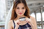 Portrait Of Thai Chinese Adult Beautiful Girl Denim Blue Bag Credit Card Stock Photo