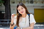 Portrait Of Thai Chinese Adult Glasses Beautiful Girl Denim Blue Bag Relax And Smile Stock Photo