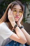 Portrait Of Thai Chinese Adult Glasses Beautiful Girl Denim Blue Bag Relax And Smile Stock Photo