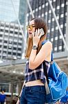 Portrait Of Thai Chinese Adult Glasses Beautiful Girl Denim Blue Calling Smart Phone Stock Photo