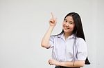 Portrait Of Thai High School Student Uniform Beautiful Girl Pointing Stock Photo