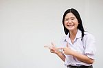 Portrait Of Thai High School Student Uniform Beautiful Girl Pointing Stock Photo