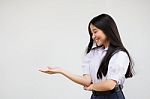 Portrait Of Thai High School Student Uniform Beautiful Girl Show Hand Stock Photo