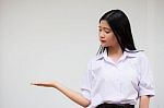 Portrait Of Thai High School Student Uniform Beautiful Girl Show Hand Stock Photo