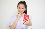 Portrait Of Thai High School Student Uniform Beautiful Girl Using Her Smart Phone Selfie Stock Photo