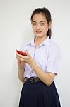 Portrait Of Thai High School Student Uniform Teen Beautiful Girl Using Her Phone And Smile Stock Photo