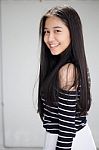 Portrait Of Thai Student Teen Beautiful Girl Relax And Smile Stock Photo