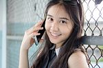 Portrait Of Thai Teen Beautiful Girl Calling Smart Phone Stock Photo