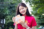 Portrait Of Thai Teen Beautiful Girl In Chinese Dress, Happy New Year And Open Box Gift, Smile And Very Happy Stock Photo