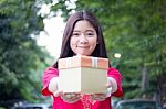 Portrait Of Thai Teen Beautiful Girl In Chinese Dress, Happy New Year And Open Box Gift, Smile And Very Happy Stock Photo