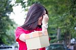 Portrait Of Thai Teen Beautiful Girl In Chinese Dress, Happy New Year And Open Box Gift, Smile And Very Happy Stock Photo