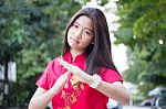 Portrait Of Thai Teen Beautiful Girl In Chinese Dress, Relax And Smile Stock Photo