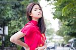 Portrait Of Thai Teen Beautiful Girl In Chinese Dress, Relax And Smile Stock Photo