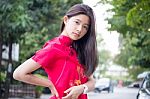 Portrait Of Thai Teen Beautiful Girl In Chinese Dress, Relax And Smile Stock Photo