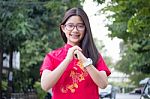 Portrait Of Thai Teen Beautiful Girl In Chinese Dress, Relax And Smile Stock Photo