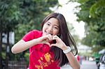 Portrait Of Thai Teen Beautiful Girl In Chinese Dress, Relax And Smile Stock Photo