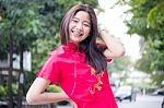 Portrait Of Thai Teen Beautiful Girl In Chinese Dress, Relax And Smile Stock Photo