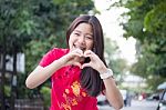 Portrait Of Thai Teen Beautiful Girl In Chinese Dress, Relax And Smile Stock Photo