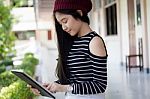 Portrait Of Thai Teen Beautiful Girl Using Her Tablet Stock Photo