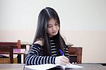 Portrait Of Thai Teen Beautiful Girl Writing Book Stock Photo