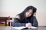 Portrait Of Thai Teen Beautiful Girl Writing Book Stock Photo