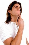 Portrait Of Thinking Man Looking Up Stock Photo