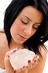 Portrait Of Woman Holding Stone On An Isolated Background Stock Photo