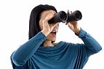 Portrait Of Woman Looking Through Binocular On White Background Stock Photo