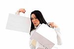 Portrait Of Woman Showing Shopping Bags On White Background Stock Photo