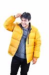 Portrait Of Young Asian Man Wearing Yellow Winter Jacket And Bla Stock Photo