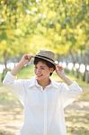 Portrait Of Young Beautiful Asian Woman Wearing Straw Hat With S Stock Photo