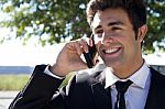 Portrait Of Young Businessman Talking With Smartphone Stock Photo