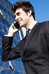 Portrait Of Young Businessman Talking With Smartphone Stock Photo