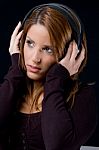 Portrait Of Young Woman Listening Music Stock Photo