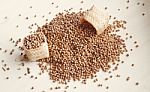 Pouring Spice Seed On The Wooden Board Stock Photo