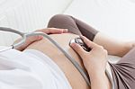 Pregnant Belly With Stethoscope Stock Photo