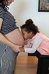 Pregnant Woman And Her Daughter Stock Photo