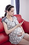 Pregnant Woman With Smart Phone Stock Photo