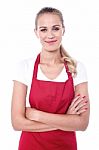 Pretty Chef Dressed In Red Apron Stock Photo