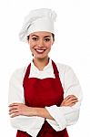 Pretty Chef Posing With Folded Arms Stock Photo