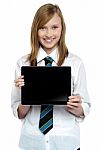 Pretty College Girl Displaying A Tablet Device Stock Photo