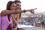 Pretty Girls Looking At The Views In The City Stock Photo