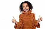 Pretty Kid Laughing And Showing Double Thumbs Up Stock Photo