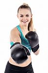 Pretty Lady Working Out Wearing Boxing Gloves Stock Photo