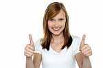 Pretty Teenager Gesturing Double Thumbs Up Stock Photo