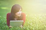 Pretty Woman Using Tablet Stock Photo